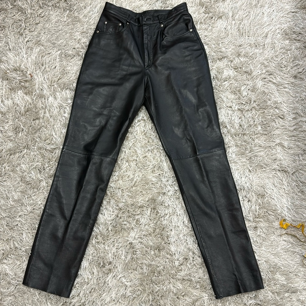 Ladies’ black leather jean style pants. Size 10.